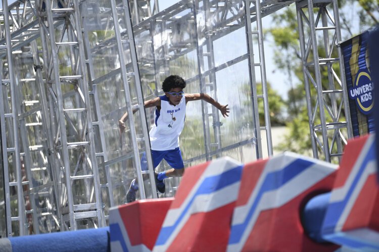 Nathanael Honvou  competing in age group 9-10 on American Ninja Warrior Junior - Season 2.